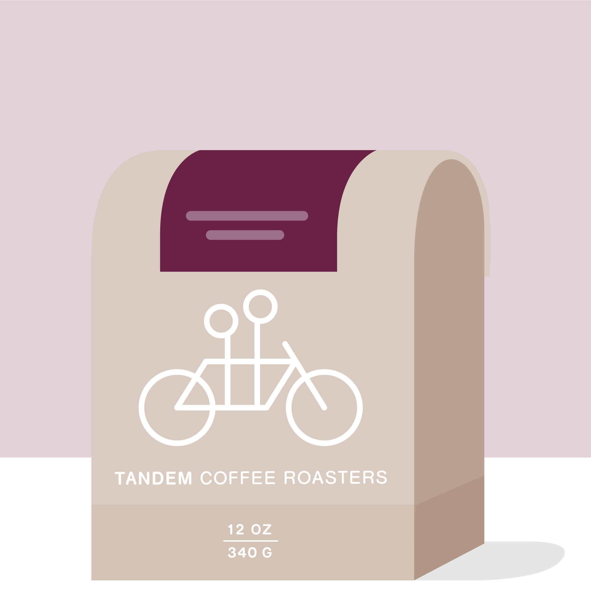A beige 12 oz (340 g) coffee bag from Tandem Coffee Roasters, labeled “Kamavindi - Kenya,” features a simple white tandem bicycle graphic and a dark maroon accent. The packaging highlights the coffee’s Kenyan origin from Kamavindi Estate and notes that it showcases an SL separation.